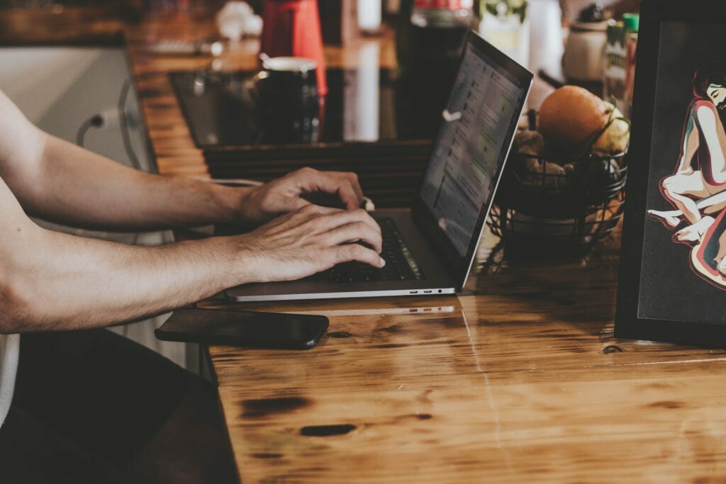 notebook on table with hands